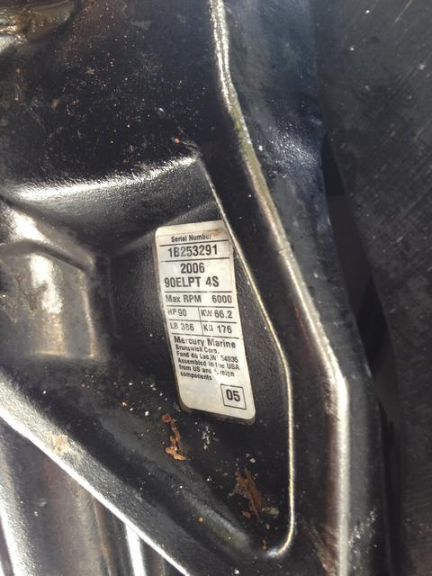Mercury outboard transom bracket showing the ID plate where the serial number is stamped