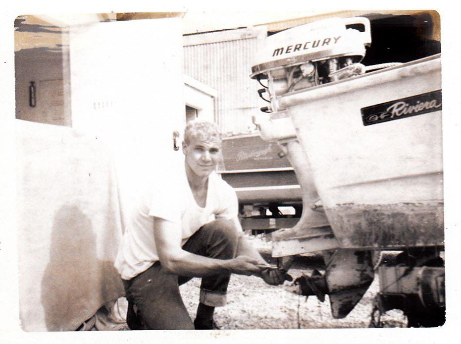 Jim Harris, 18, working on a Mercury outboard in 1965